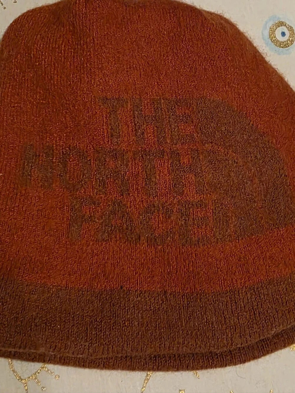 The North Face Rust Orange Knit Beanie with Subtle Logo